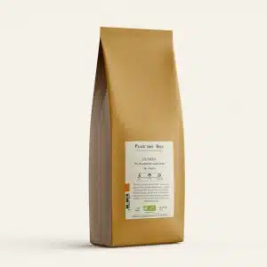 Tall brown kraft coffee bag standing upright with a white label that reads 'JASMIN' and tasting notes below, set against a pale beige background.